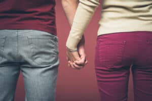 Couple holding hand in hand
