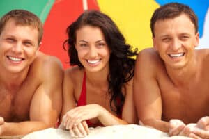 Two men and a girl smiling