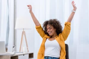 Woman raising hands in joy