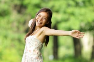 Carefree woman arms wide open