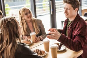 Couple and a friend having coffee