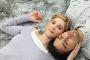 Couple laying down close to each other