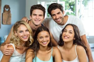 Group of friends smiling taking a photo
